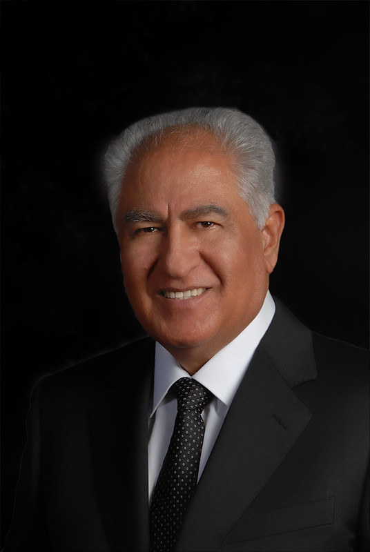 Farid A. Khavari in a dark suit and patterned tie